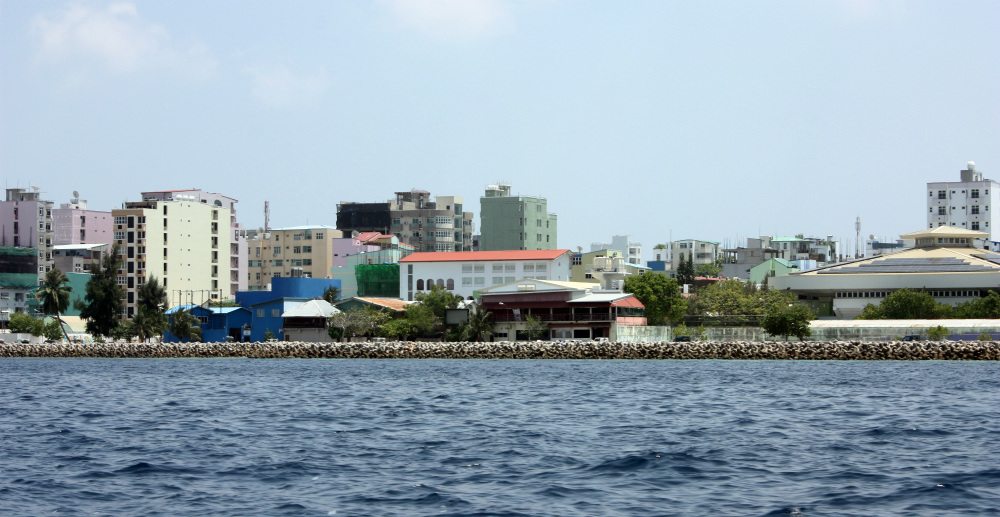The atoll Malé, capital of the Maldives. It takes under two hours to walk around the island, which is almost entirely urban and paved at sea level — there is virtually no natural coastline left 
