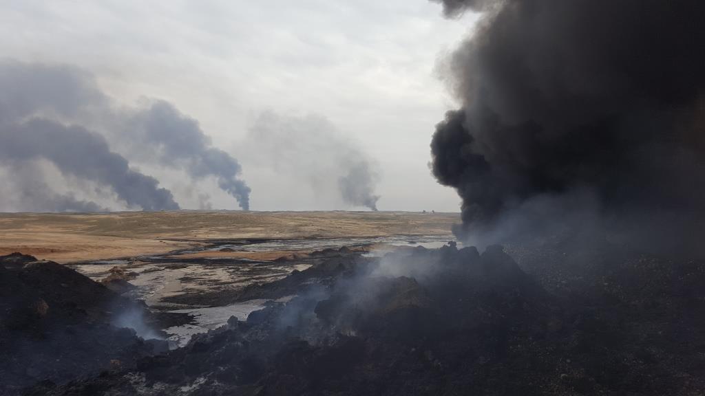In February 2017 clouds of thick, black smoke plumed from the Qayyarah oilfields near Mosul

