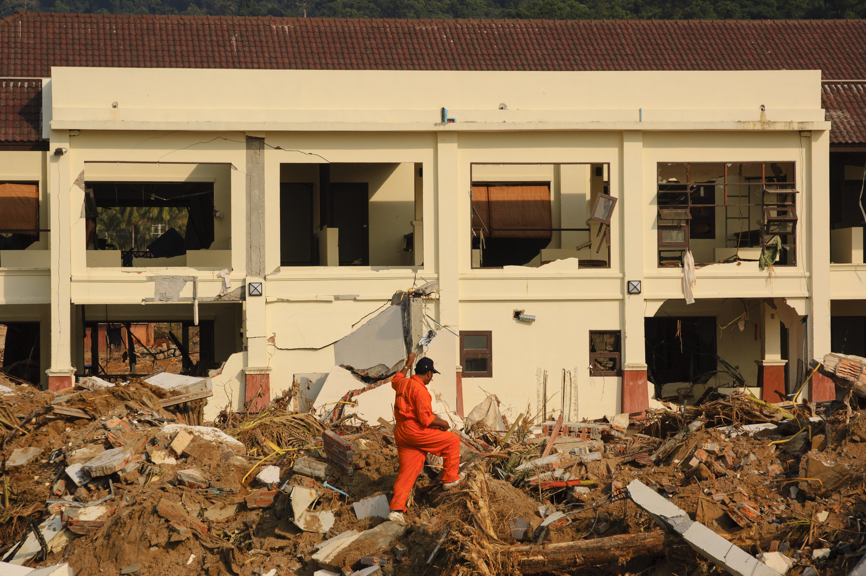 Thai search and rescue volunteer looks for corpses at Khao Lak
