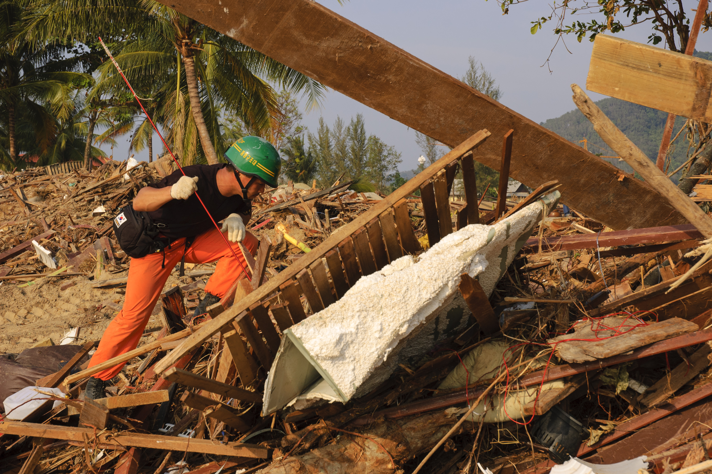 Korean search and rescue volunteer looks for corpses at Khao Lak