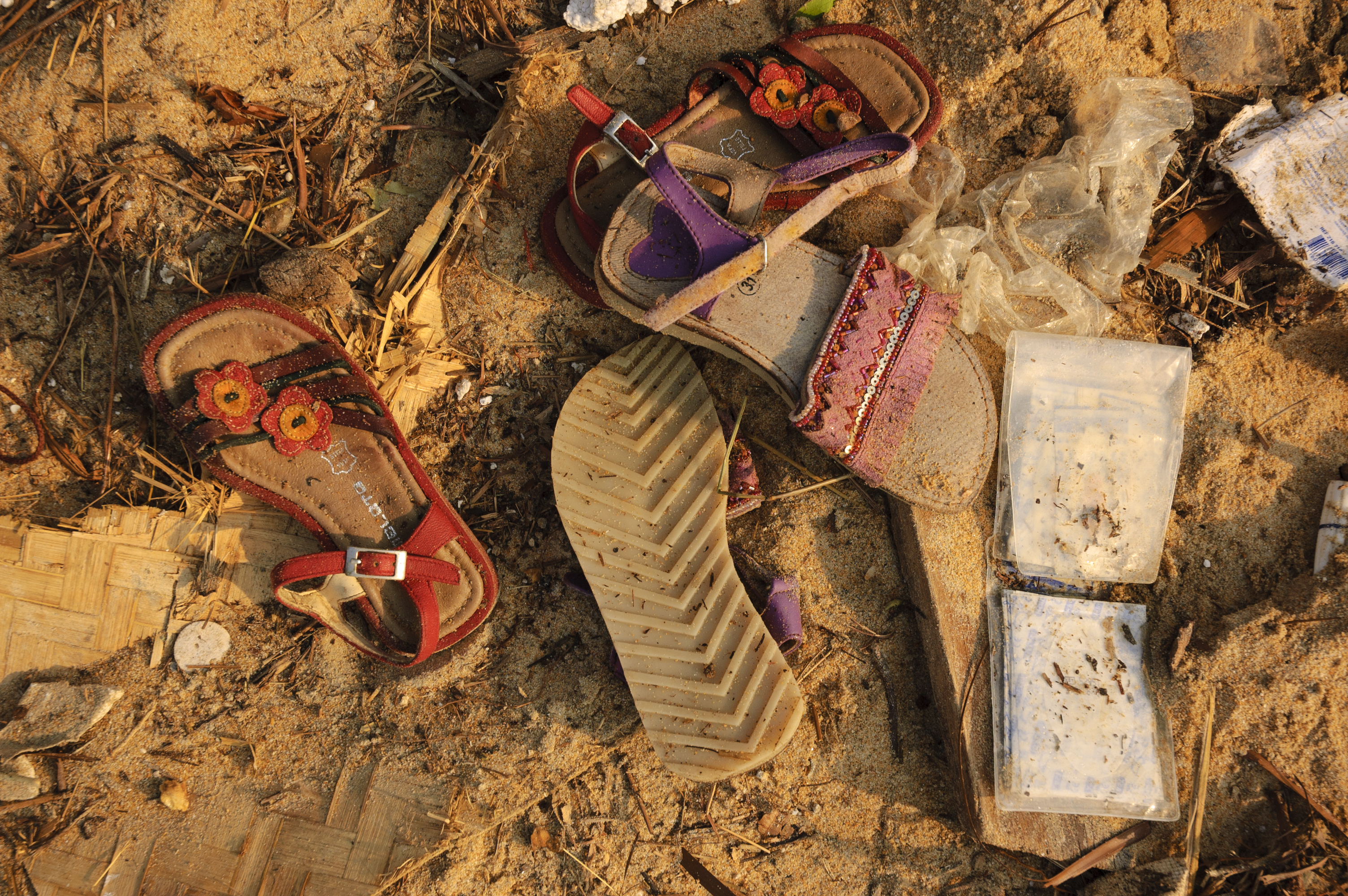 Tourists' shoes and a wallet litter the beach at Khao Lak, Thailand, following the December 26, 2004 tsunami