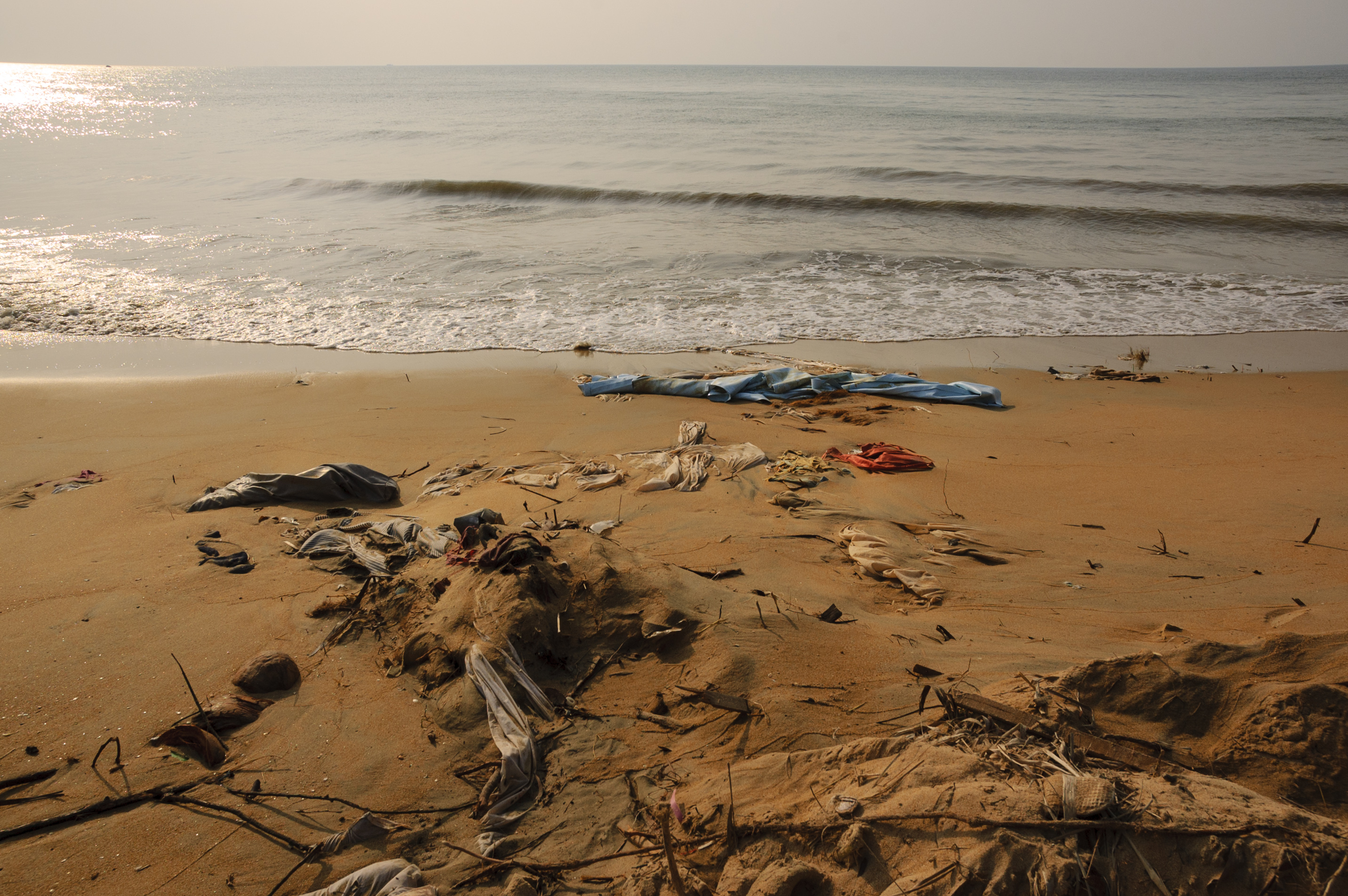 Clothing and bed sheets litter the beach at Khao Lak, Thailand, following the December 26, 2004 tsunami
