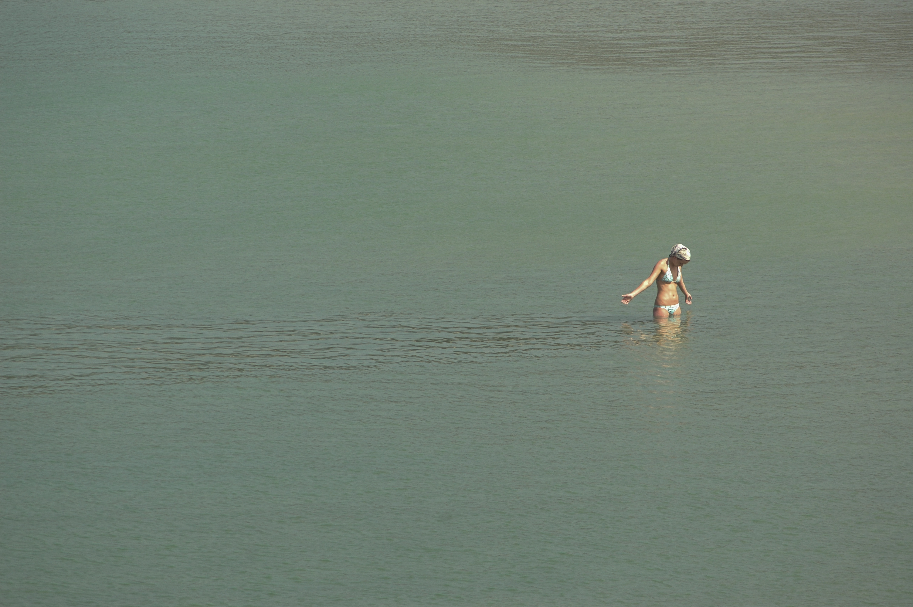 A foreign tourist takes in the morning sun along Kata Beach on Phuket island and a breather from the rescue efforts. The December 26, 2004 tsunami killed thousands in Thailand, including thousands of foreign tourists. But that did not scare off all of the remaining visitors, many of whom stayed to volunteer in relief efforts