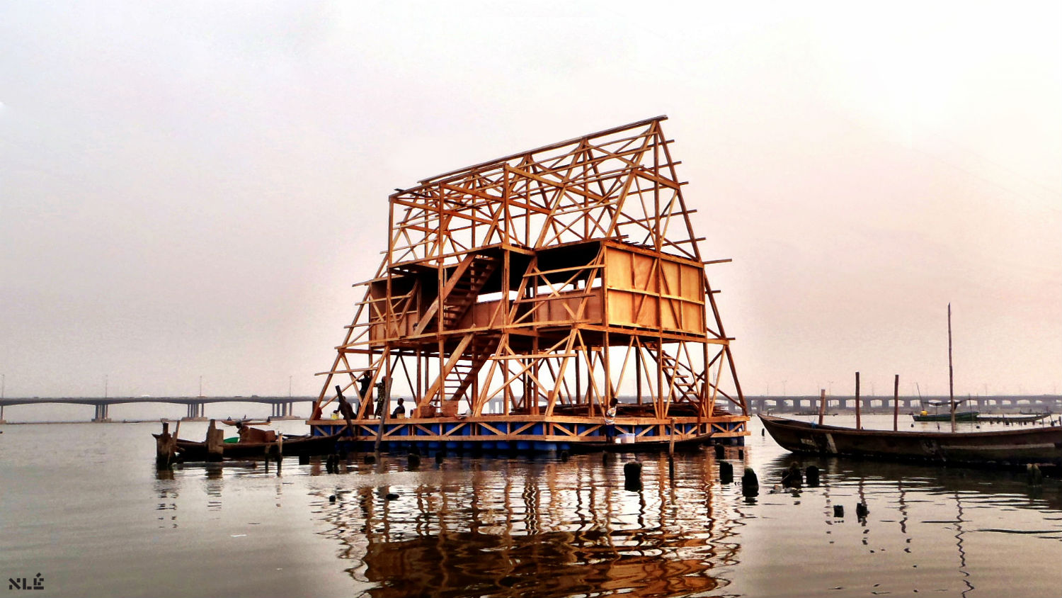 Makoko floating school, here seen mid-build. The triangular structure creates a low centre of gravity, meaning it can accommodate three storeys and 100 people without becoming unstable. It is built from local bamboo and offcuts from a local sawmill
