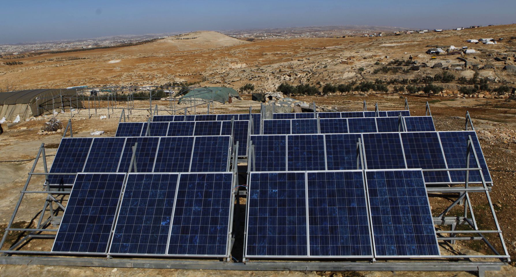 Solar panels in Sha&rsquo;eb el Buttom. South Mount Hebron is particularly suited to renewable energy, says Comet-ME cofounder Elad Orian. It&rsquo;s on the edge of a desert, so very sunny, and 800 metres above sea level, so extremely windy. In the winter there are powerful storms, with wind speeds exceeding 150 kilometres an hour
