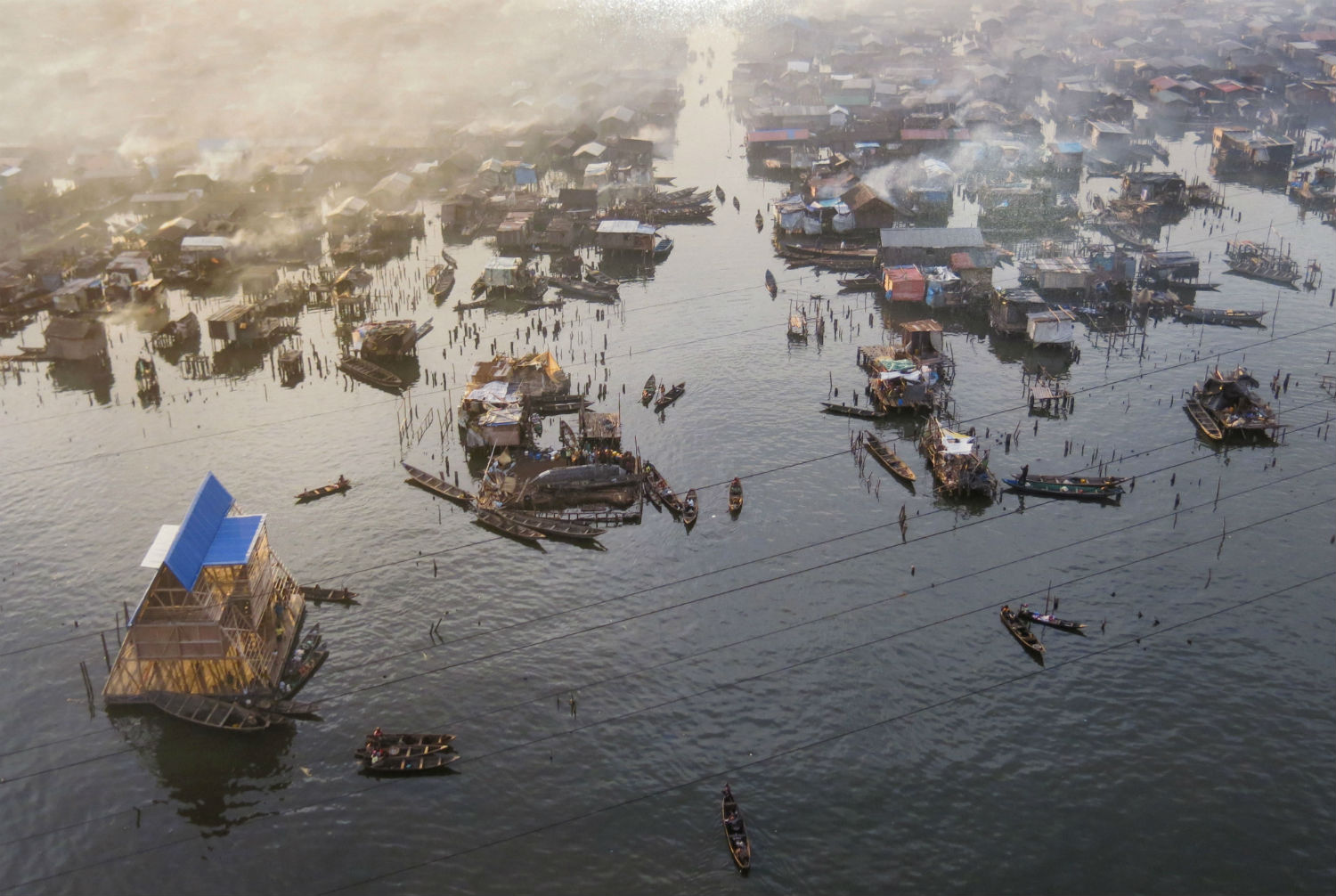 Makoko slum and finished floating school. Thousands of people live in this neighbourhood, which has grown incrementally over the centuries to create an informal but fully functioning settlement. The district is under threat from property speculators and regeneration schemes
