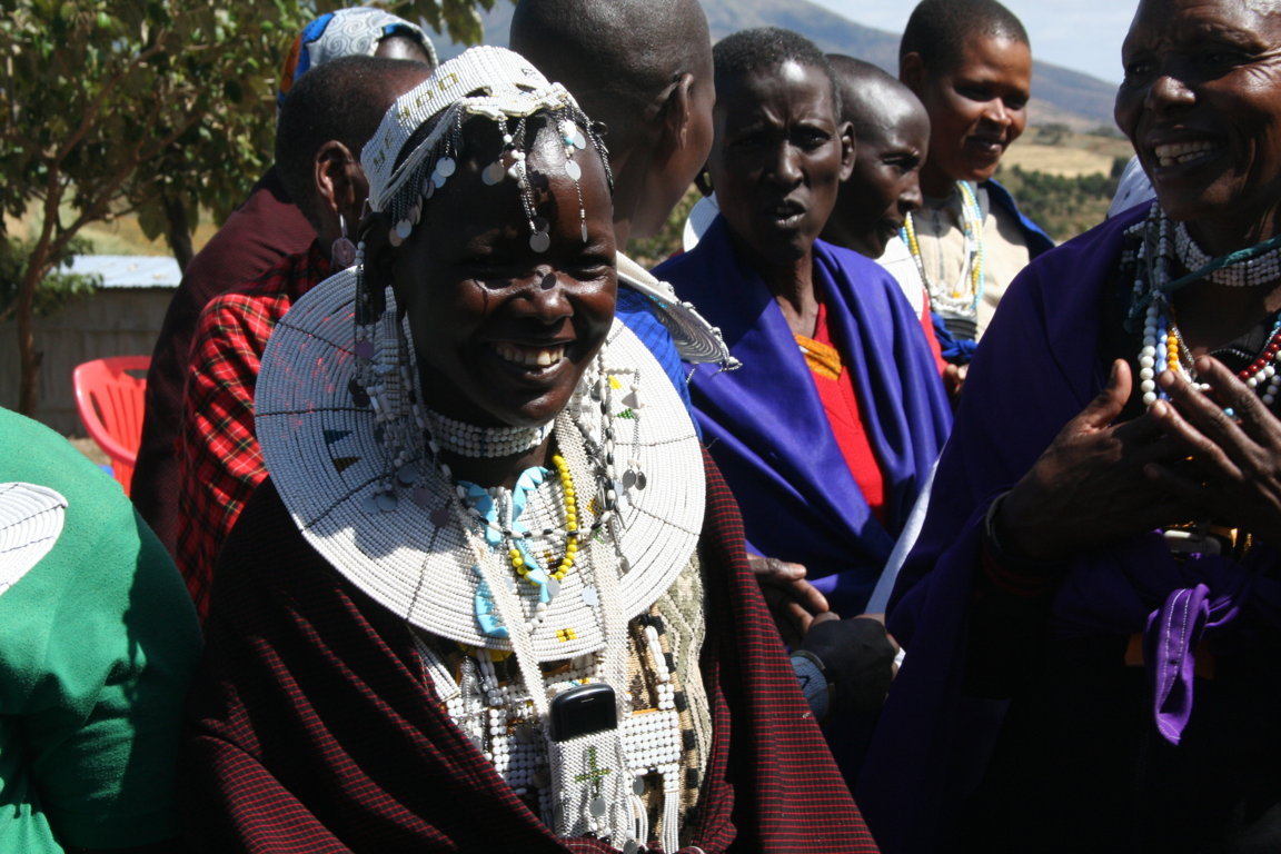 The shaven heads of Maasai women and their beaded ornaments confirm their attachment to the past while their mobile phones suggest a more empowered future.
