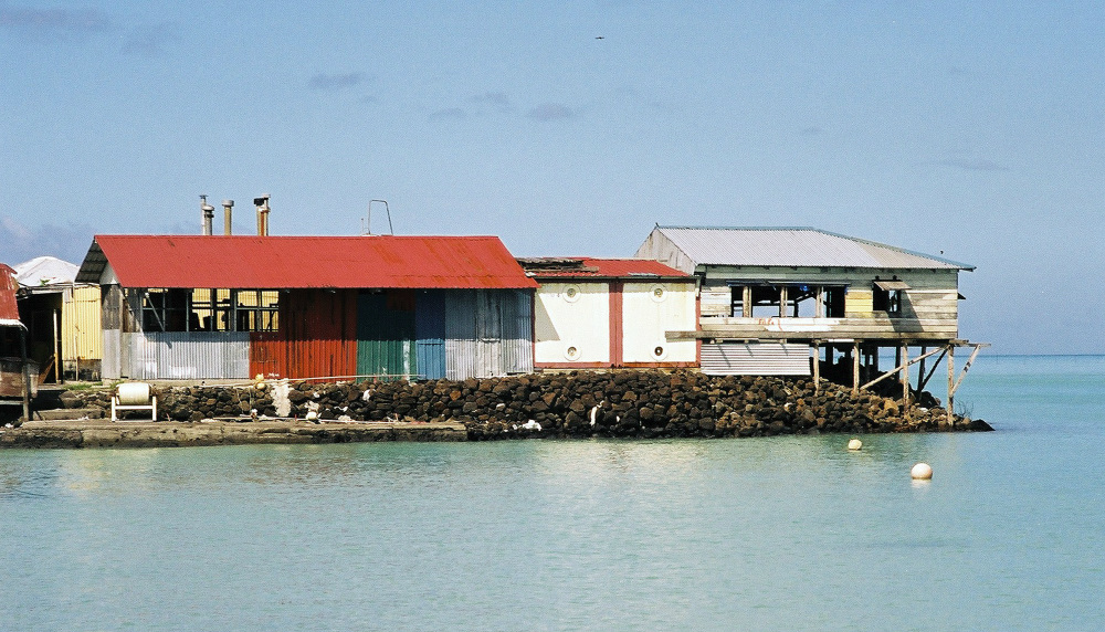 Living at sea level in Samoa. The practice of extending housing into the ocean may be considered an adaptation to pressures such as population density, or a maladaptation to climate change risks such as cyclones and rising seas
