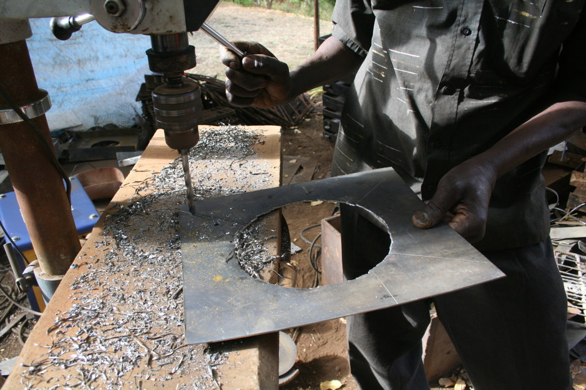 While Maasai women are happy to work with local materials such as clay for building their stoves, they are not yet ready to work with metal. The steel sheeting essential for providing durability and strength to the stoves is machined in a small foundry by men from Kenya.
