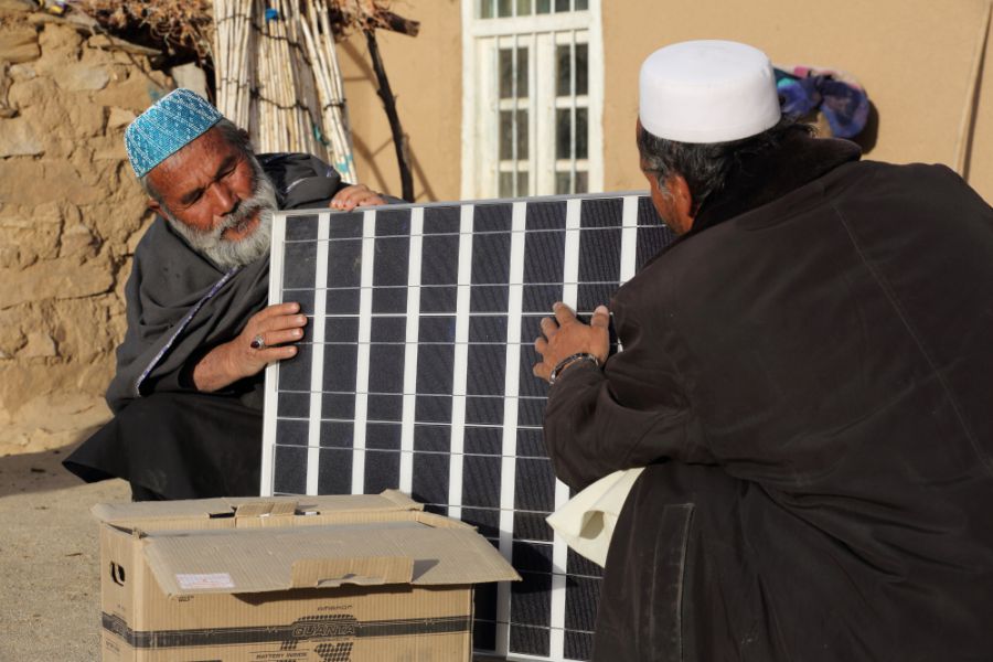 Iqbal unpacks a new solar panel delivered by Norwegian Church Aid. A solar power system will be installed on the roof of his house in Palaj village, Daykundi province 
