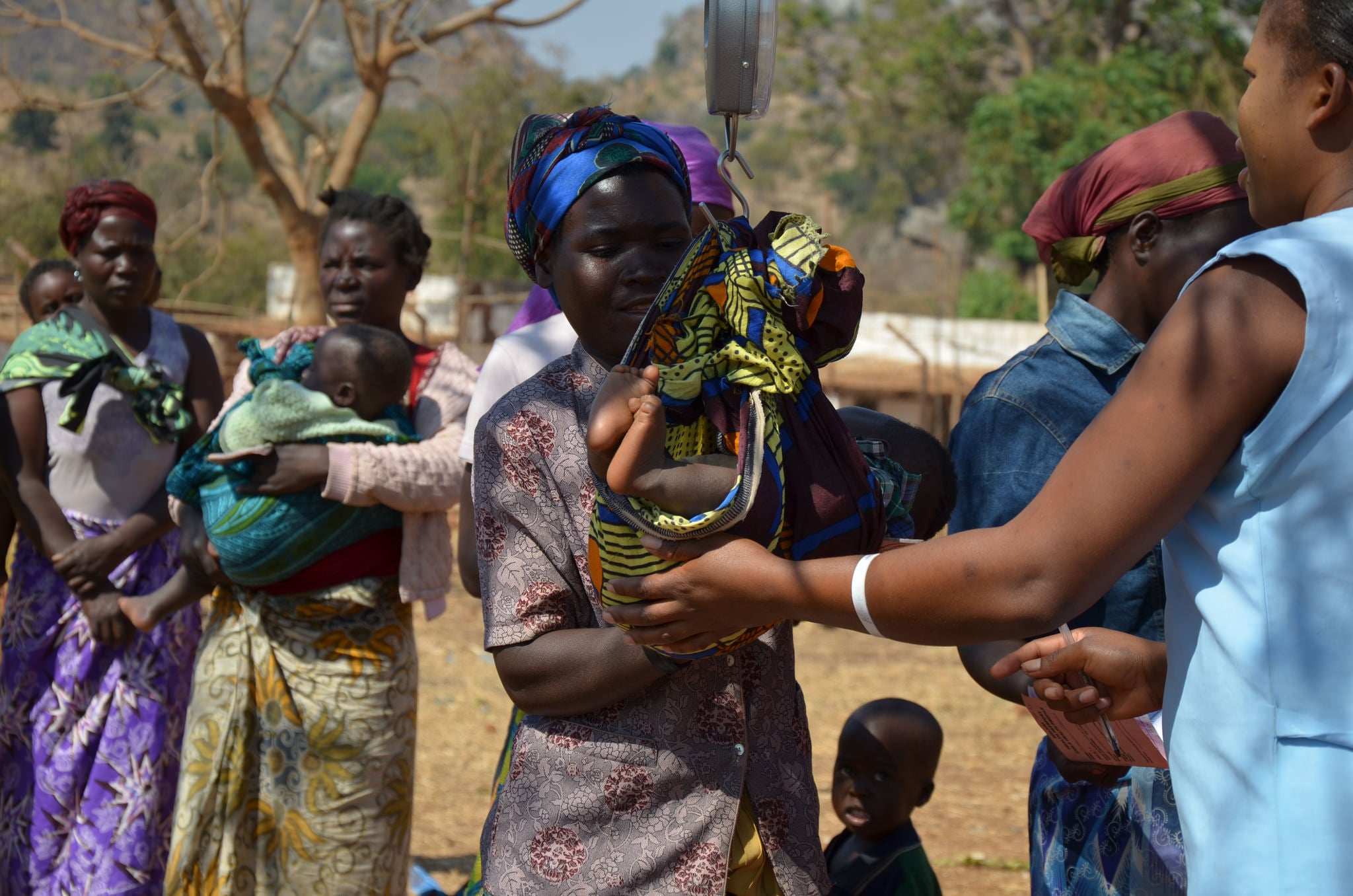 Staff at Matapila Health Centre treat malnourished children. They predict a spike in December when food stocks are at their lowest. This year, flooding and drought wrecked the harvest. These conditions have also increased the likelihood of aflatoxin contamination

