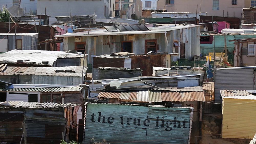 A community in a township on the edge of Cape Town. In these unplanned, informal settlements, houses are built close together from flammable waste materials. With proper alarm systems in place, people can protect each other and their homes, and continue living in close-knit communities. 
