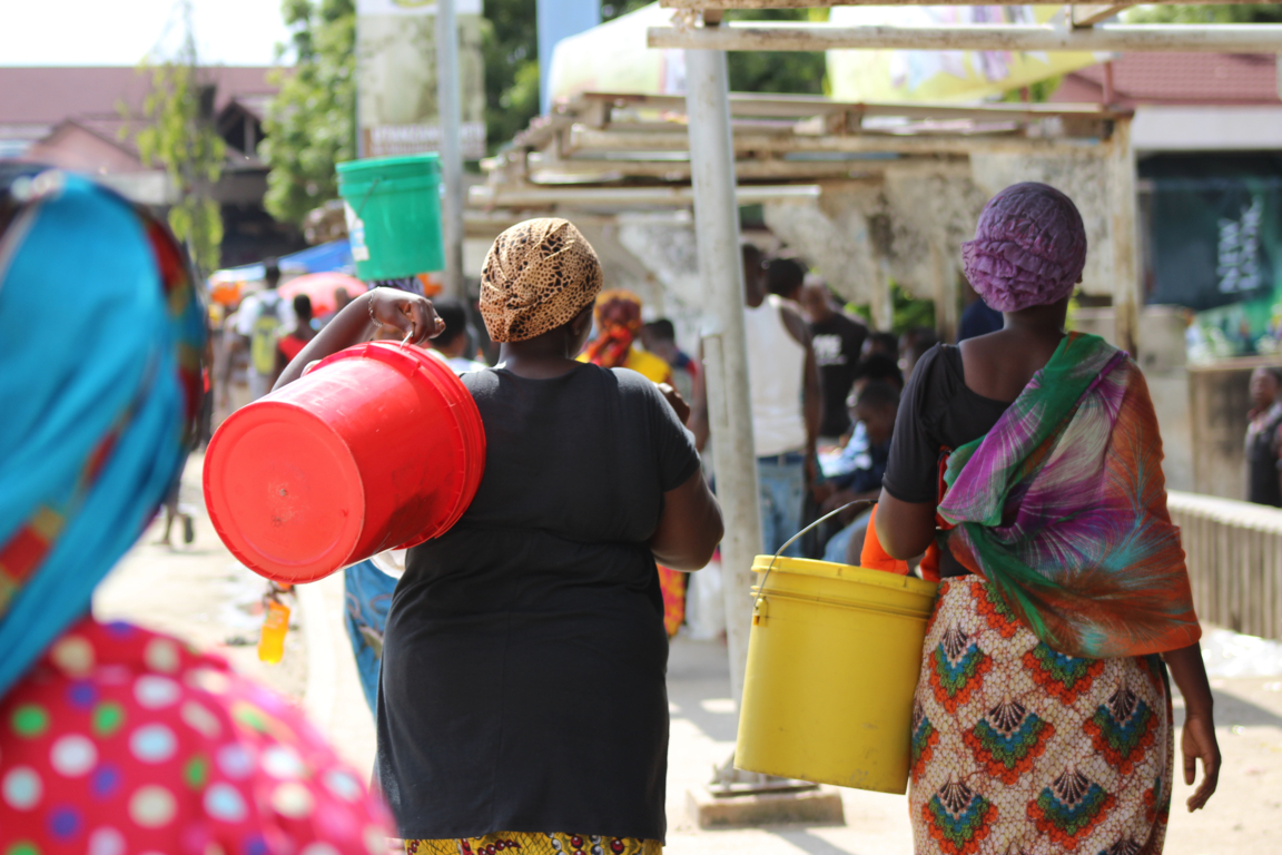 Thousands of people pass through the gates of Kivukoni market, the largest fish market in Dar es Salaam. 
