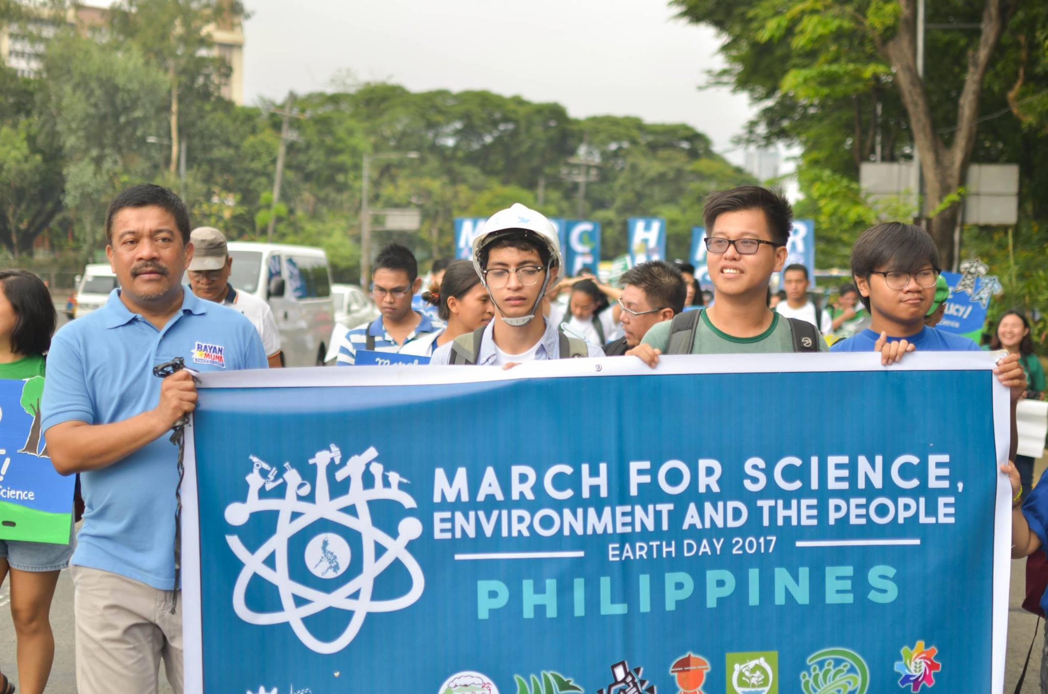The Philippines: Supporters walk through Manila with a banner for Kalikasan PNE, an environmental network, one of the science organisations that marched through the capital.  
