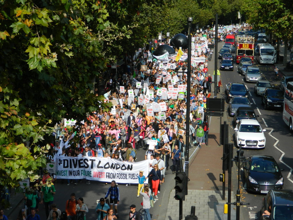 London. As petrol-fuelled cars swept along the busy embankment of the Thames as usual, demonstrators on foot were asking governments to move away from fossil fuels.
