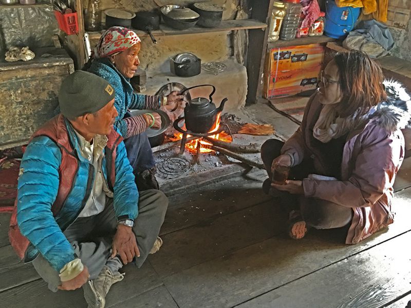 Tsechu Dolma, founder and director of NGO the Mountain Resiliency Project, talks to Langtang villagers about a project to restore agriculture in the valley. The organisation helps to build greenhouses so farmers can boost yields and diversify crop varieties
