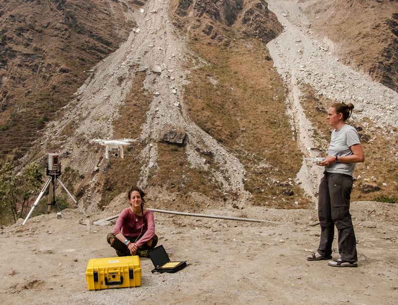 Scientists from the GFZ German Research Centre for Geosciences study landslide hazards near Chaku in northern Nepal. Sensors on the flying drone allow them to map the landslides and monitor debris movement
