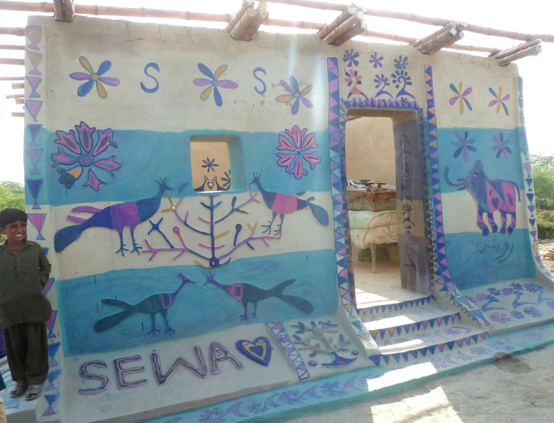 A house painted by local women in Sindh’s Mirpurkhass district. It was built with help from IOM partner CEWA, a local NGO. The villagers worked hard to raise floor levels about a metre above the ground so they survive many floods. The structure’s bamboo roof joists were pioneered by the Heritage Foundation of Pakistan
