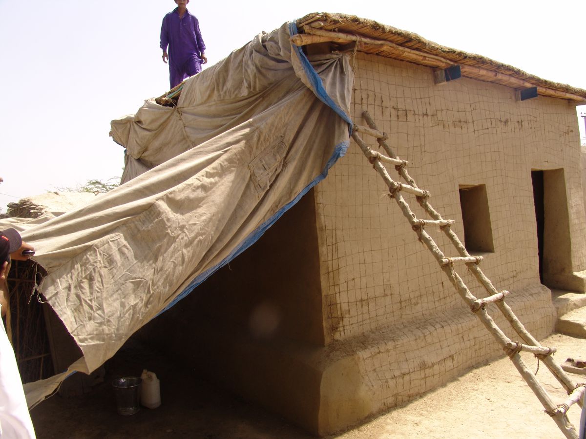 A house built using earth-lime in another village, in a project managed by the NGO ACTED. Shading the wall allows the lime coating on the blocks to slowly absorb carbon dioxide from the air, becoming much harder and more water resistant over time. If it carbonates properly, it will continue getting harder for hundreds of years
