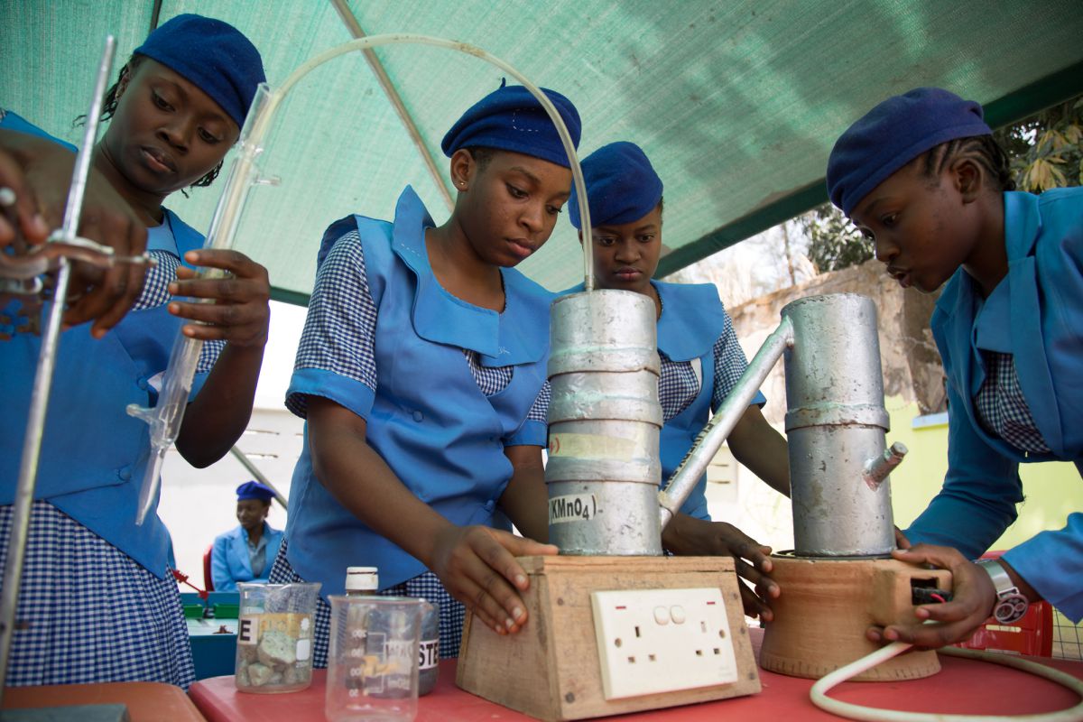 Pupils from Government Girls Secondary School Dutse work on their science project aimed at extracting harmful chemicals from non-biodegradable waste and turning the rest into fuel. Fifteen-year-old Audam Peace (far left) wants to become a gynaecologist. She says determination matters most to achieving any goal
