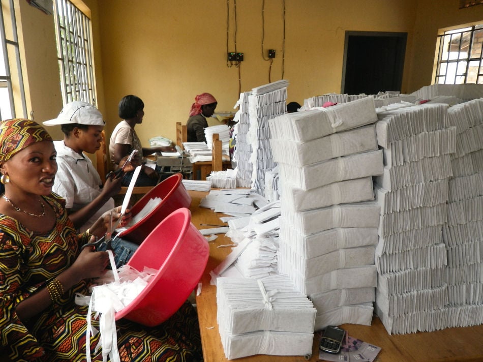 Workers making MakaPads — women’s sanitary pads made from recycled office paper and locally grown papyrus — at a factory in a refugee settlement. The pads are cheaper and more environmentally friendly than imported products.