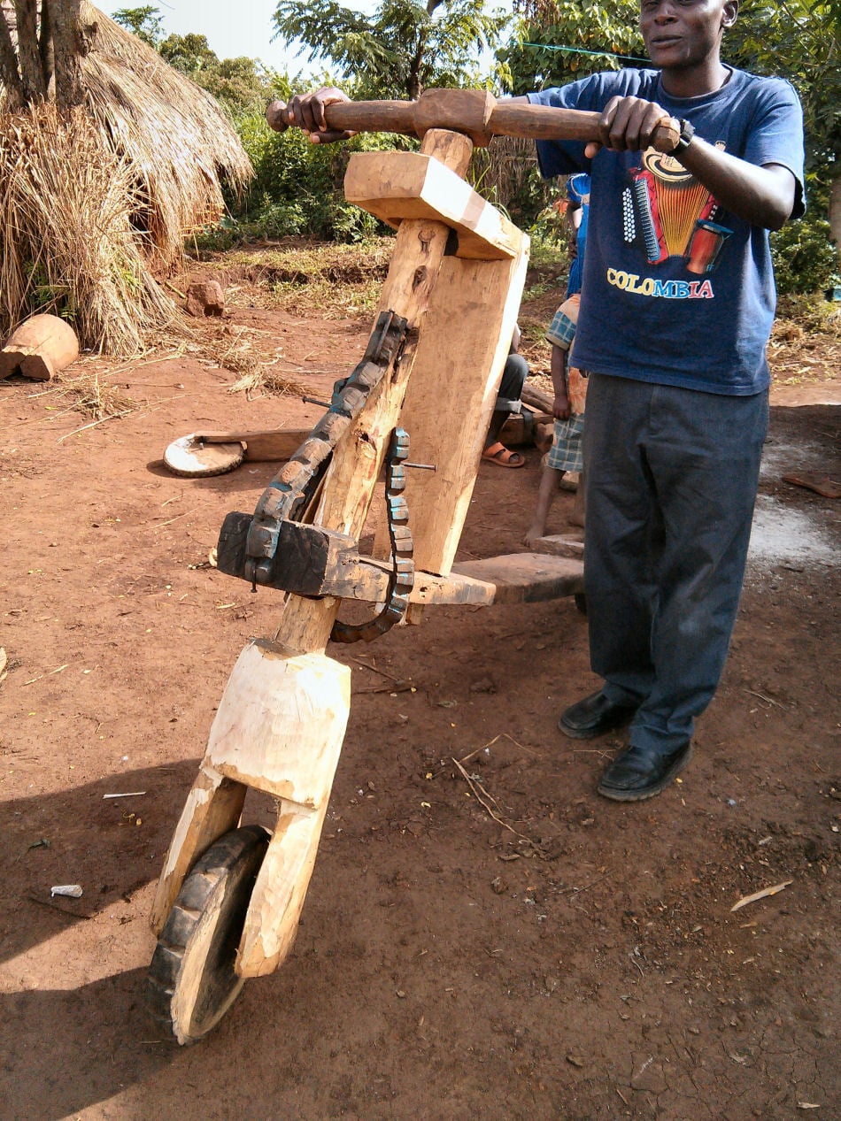 A handmade wooden bike for transporting goods in Kyangwali refugee settlement. Such bikes are made from locally available resources, including wood and old vehicle tyres.