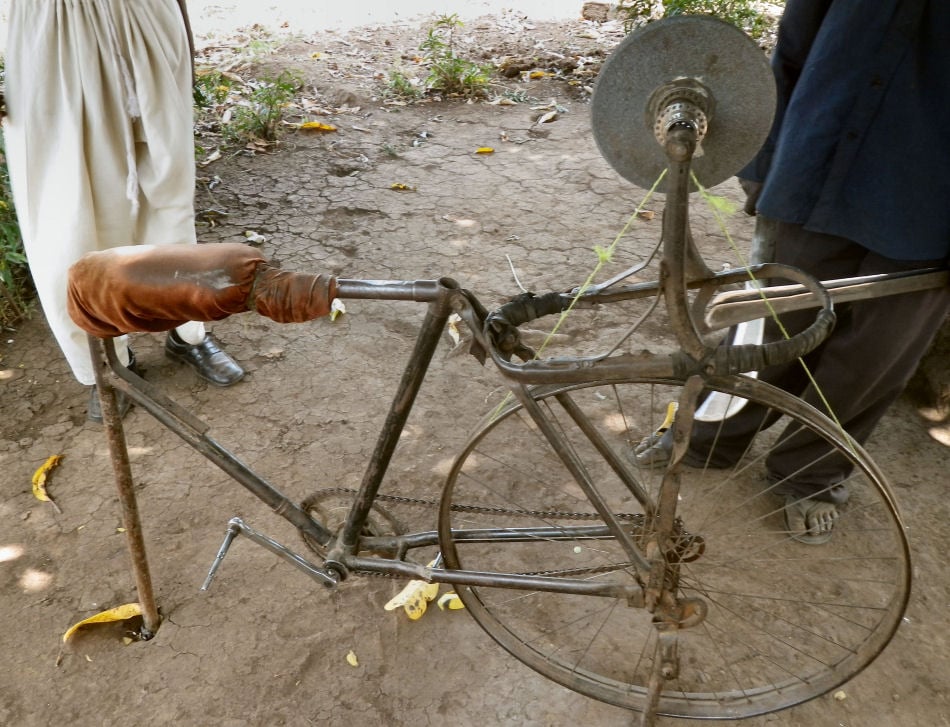 An adapted bicycle for sharpening farm tools in Nakivale refugee settlement.